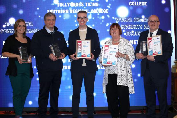 Left to right: Pamela Frizell, and John Burns, NIE Networks, who were winners of the Large Employer Award, David Meade, event host, Heather Cousins, DfE, and David Russell of Northern Regional College