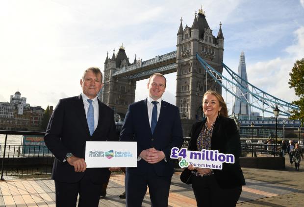 Economy Minister Gordon Lyons, pictured centre with Christopher Brooke, Chairman of Tourism Ireland; and Judith Cassidy, Tourism Ireland’s Acting Head of Great Britain standing beside Tower Bridge, London