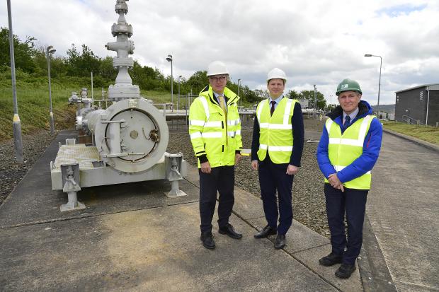 Gerard McIlroy, Finance Director at Mutual Energy, Economy Minister Gordon Lyons and David Surplus, CEO, B9 Energy at Ballylumford Power Station.. 