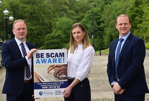 Economy Minister Gordon Lyons pictured with Damien Doherty, Chief Trading Standards Officer for Northern Ireland and Trading Standards Area Inspector Linda Houston at the launch of the National Scams Awareness Campaign which runs from 