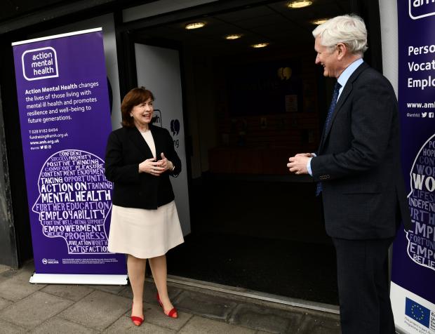 Economy Minister with David Babington from Action Mental Health on a visit to their Belfast premises. 