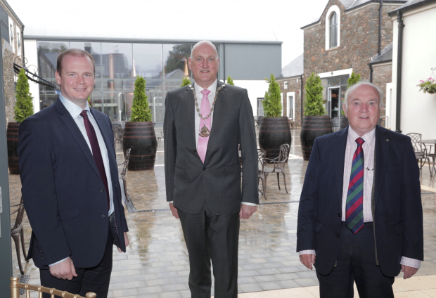 Economy Minister Gordon Lyons with Lisburn Chamber of Commerce President Garry MacDonald and owner of Hinch Distillery and Visitor Centre Dr Terry Cross OBE.