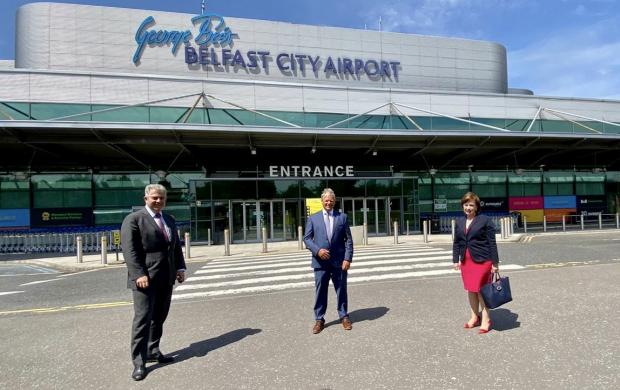 Brandon Lewis, Brian Ambrose and Diane Dodds at Belfast City Airport