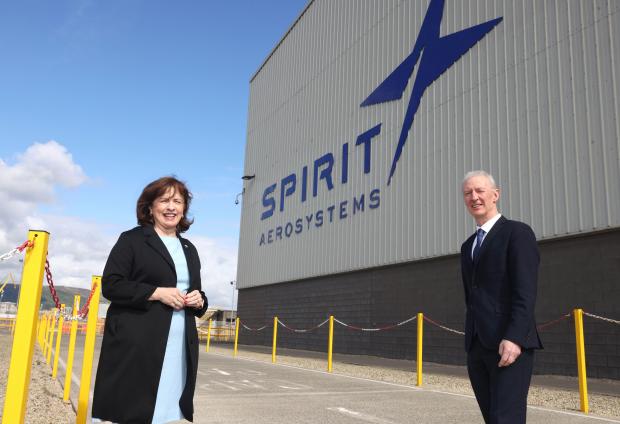Economy Minister Diane Dodds with Spirit AeroSystems vice president and general manager Michael Ryan pictured with the new Spirit AeroSystems branding outside the wing factory.